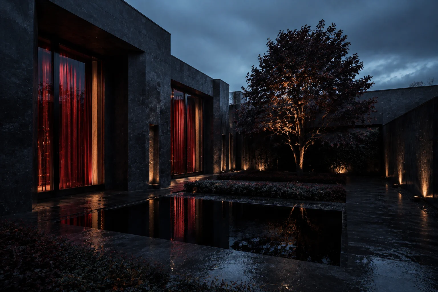 A sculptural modern courtyard illuminated in deep red and warm gold